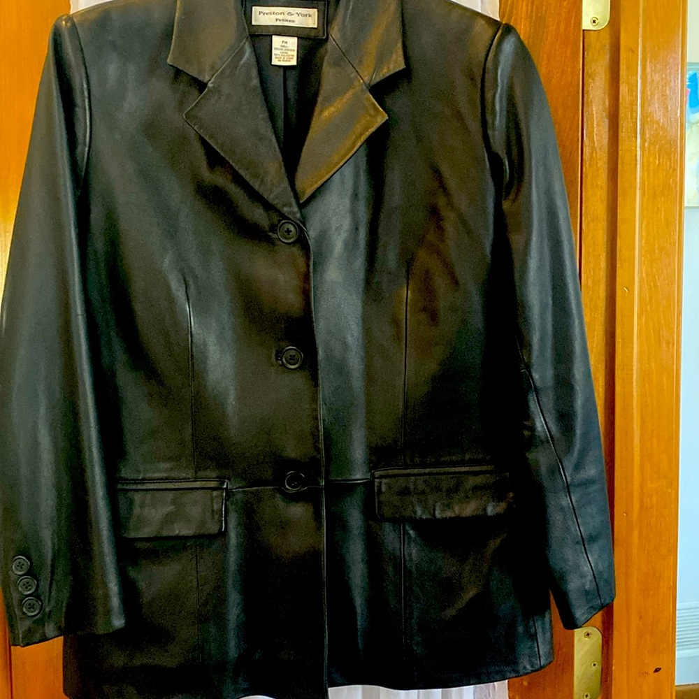 Gently worn lamb skin leather jacket.  No tears in 100% polyester lining